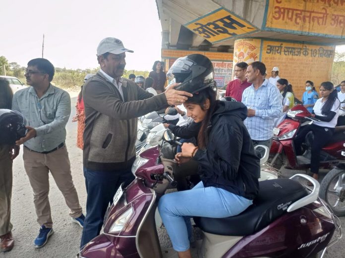 Helmets distributed to 132 people under road safety campaign