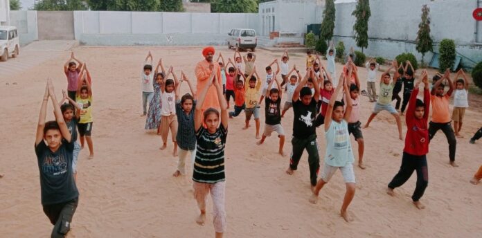 Swami Satchidananda told about the benefits of doing asanas in the camp.