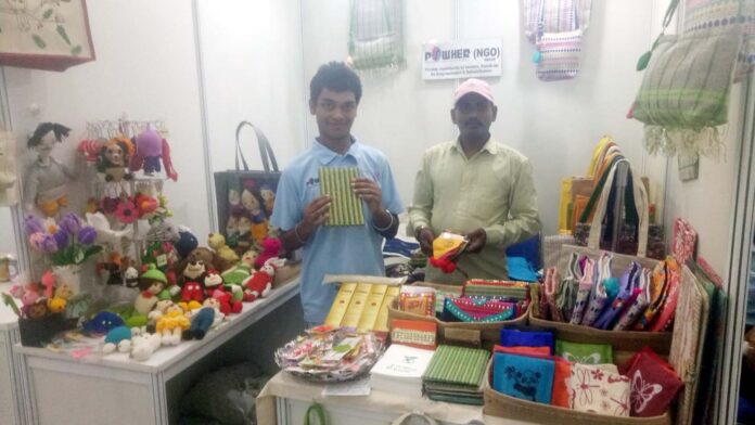 Stall operators showing their products in the exhibition held at Apparel House