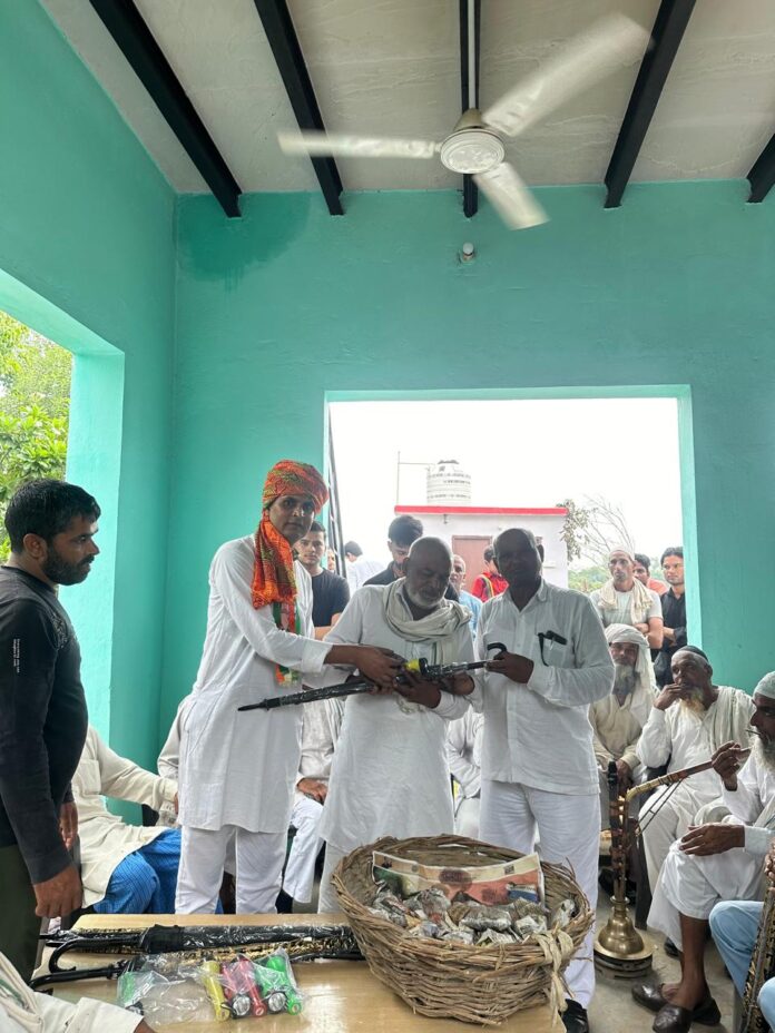 Presented batteries and umbrellas to hundreds of villagers