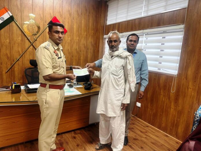 Checks worth Rs 90 lakh handed over to the family of the policeman who lost his life in a road accident