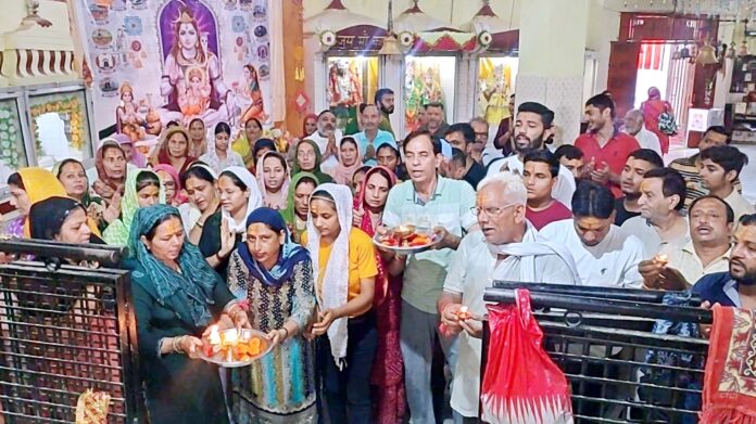 Crowds of devotees gathered in temples on the last Monday of the month of Sawan