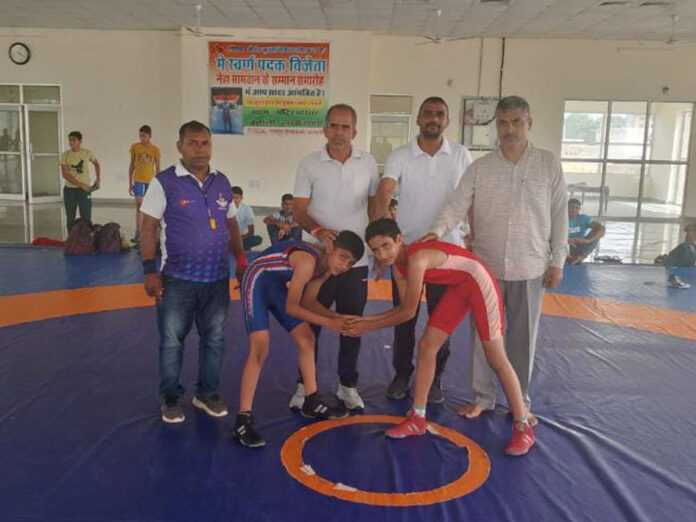 District level female school wrestling competition was organized in village Balali.