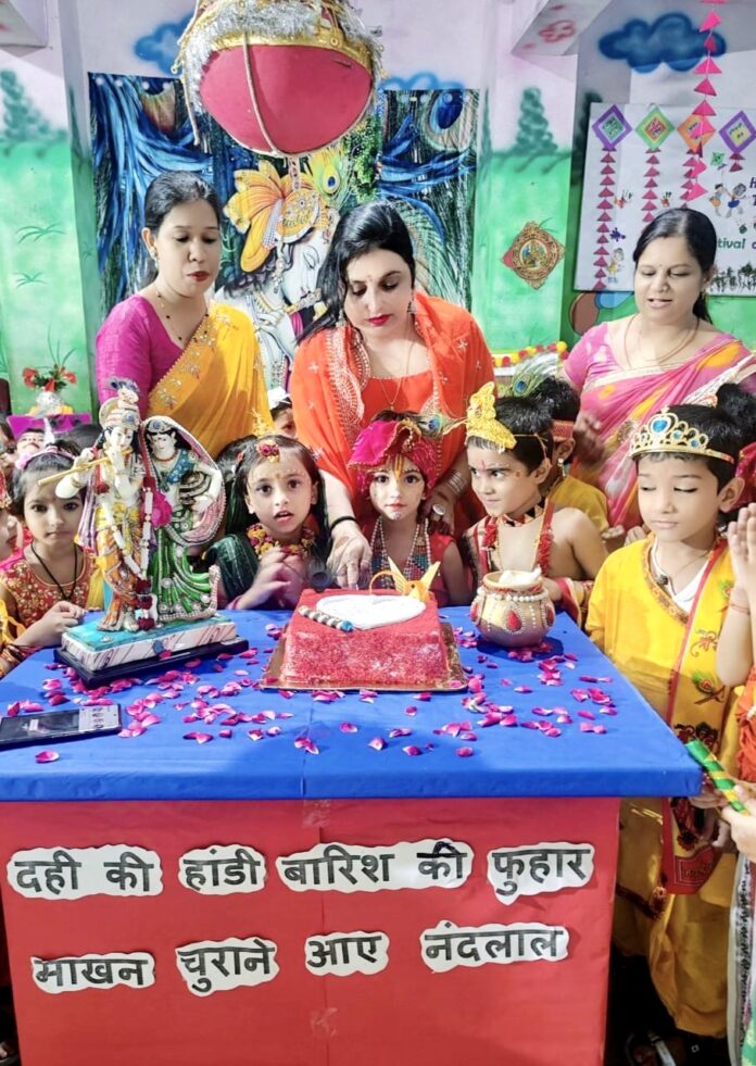 Chairperson Nisha Saini and staff members celebrating the birth anniversary of Shri Krishna by cutting the cake.