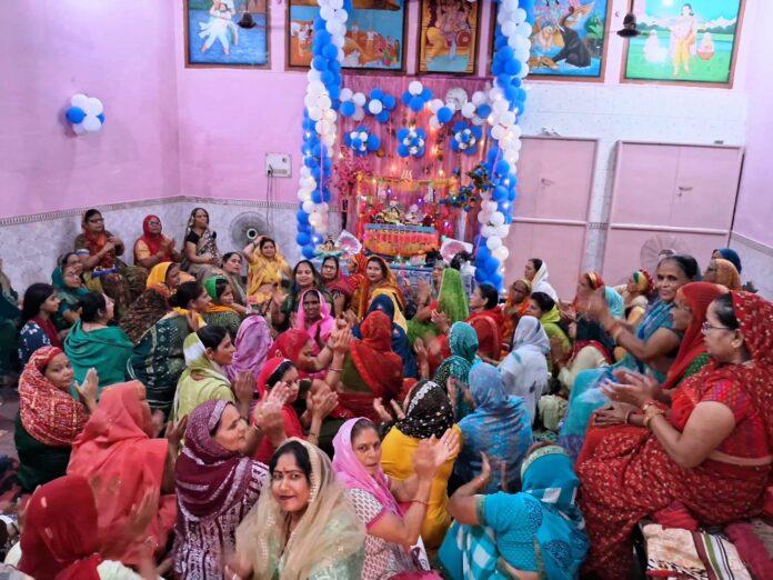 Devotees dancing during the Chhathi ceremony and Sankirtan of Lord Krishna