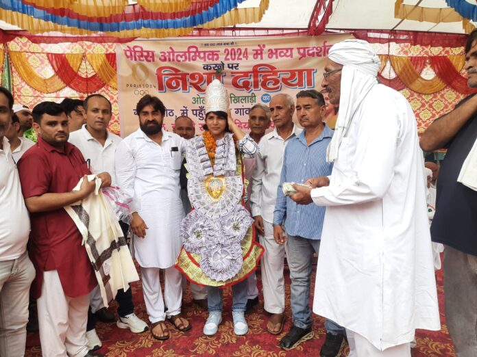 Olympian wrestler Nisha Dahiya welcomed in Jharoth village