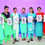 Nursing students applied mehendi on their hands giving the message of 100% voting.