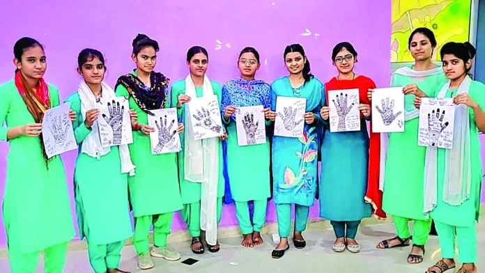 Nursing students applied mehendi on their hands giving the message of 100% voting.