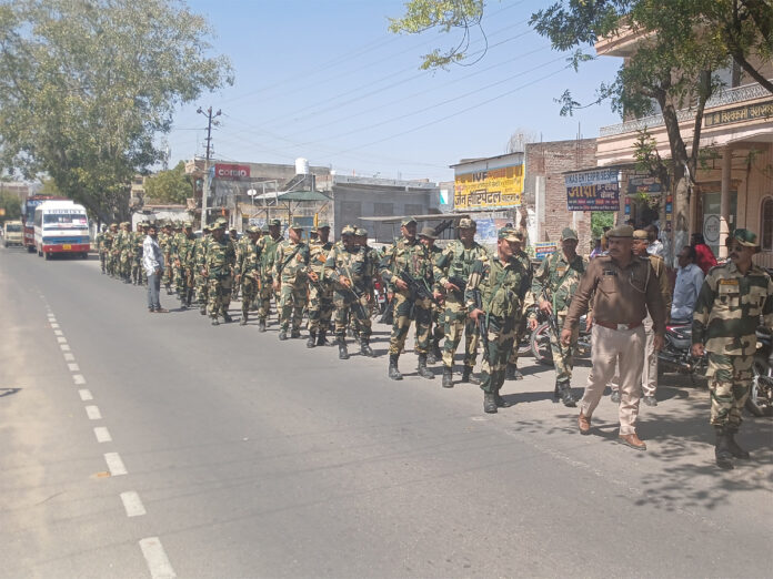 Police and RPF personnel took out a flag march for the assembly elections