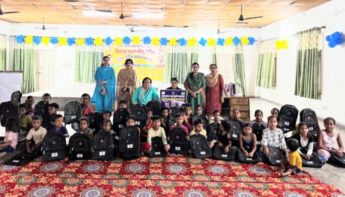 Distribution of school bags to slum area children by Innerwheel Club Panipat Midtown.