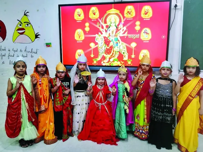 P.H. The festival of Durga Ashtami was celebrated with great pomp and joy in the school.