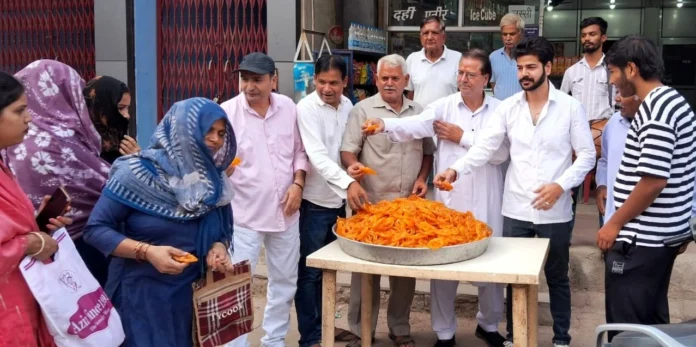 Saini community celebrated by playing drums and distributing jalebi on Naib Saini becoming CM again.