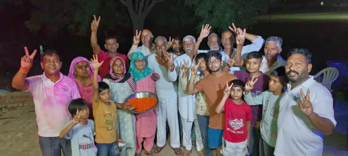 Workers distributed laddus on Sunil Sangwan's victory