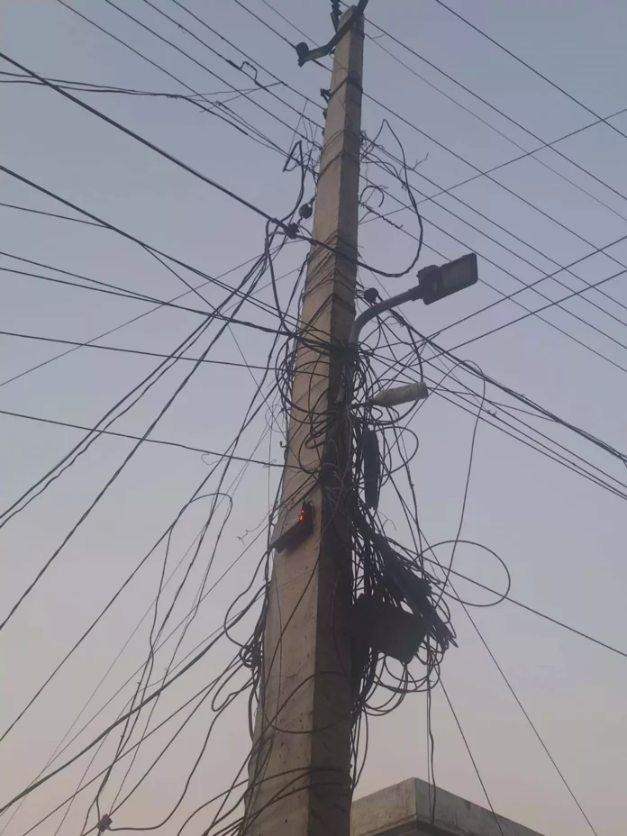 Electricity workers are getting entangled in the web of cables and internet wires on the poles