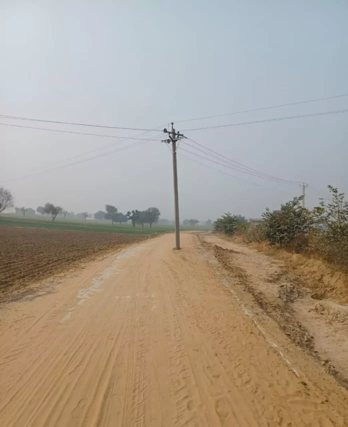 Electricity pole standing on the main road of two villages connecting village Gopi Jagarambas, department asked for money to remove it