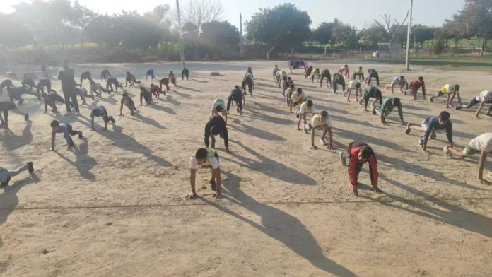 Players participated in de-addiction public awareness and yoga camp at Neeraj Chaudhary Sports Stadium.