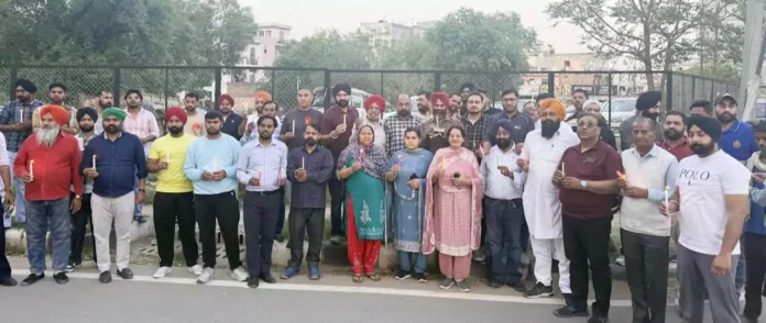 A candle march was taken out in Manimajra demanding a college